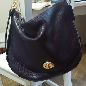 Beautiful plum coach purse like new!